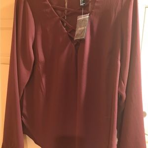 Very nice crisscross blouse in the front, Beautiful color of burgundy.